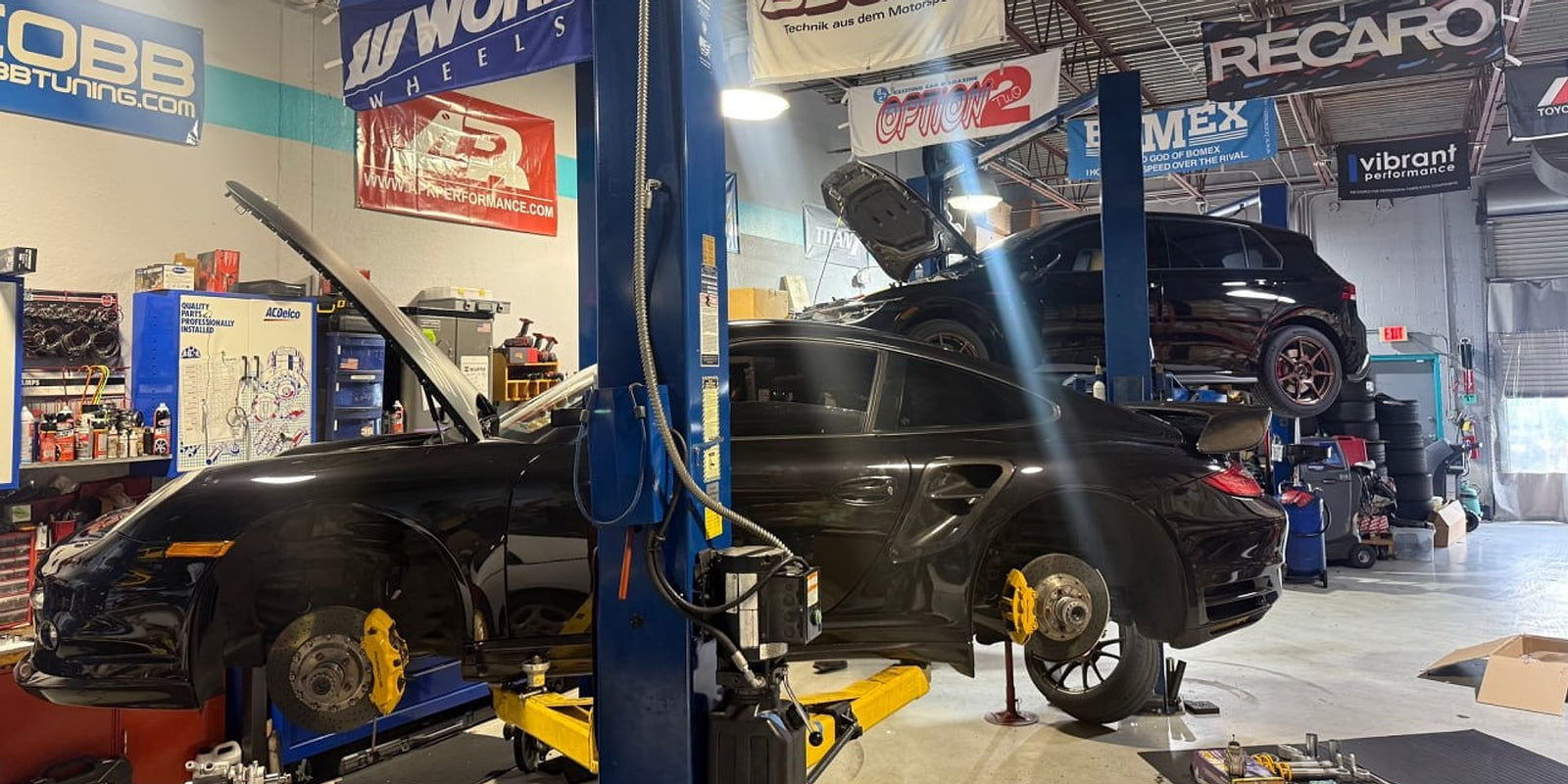 Porsche 911 Turbo on a lift in the Velocity Factor service bay